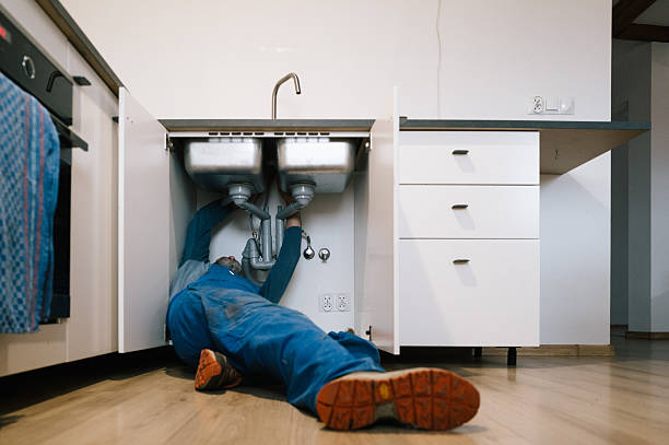 Professional Emergency Plumber technician working in Howard, WI